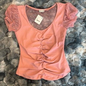 fitted, dusty pink, mesh sleeve and back, soft top